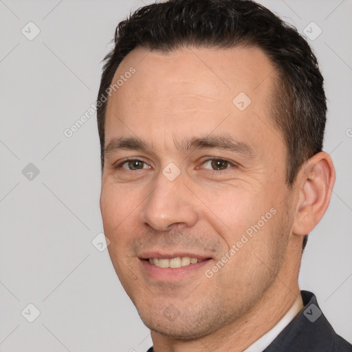 Joyful white adult male with short  brown hair and brown eyes