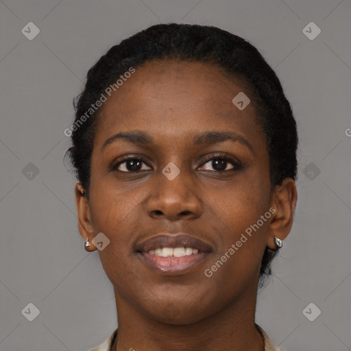 Joyful black young-adult female with short  brown hair and brown eyes