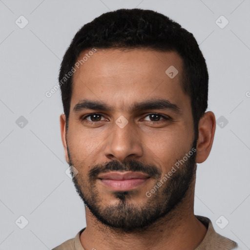 Neutral latino young-adult male with short  black hair and brown eyes