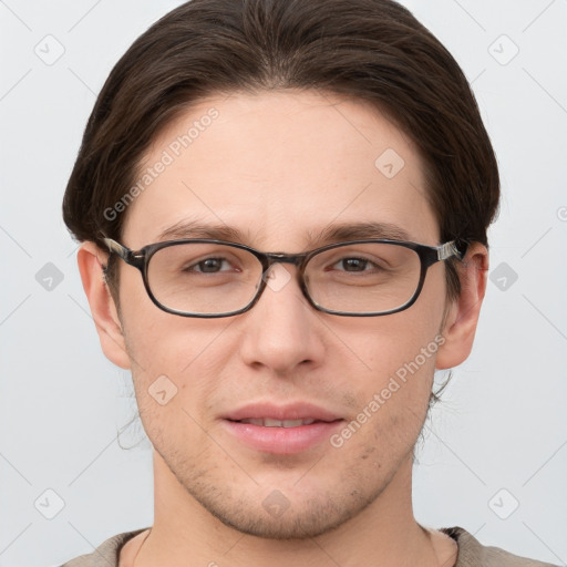 Joyful white young-adult male with short  brown hair and grey eyes