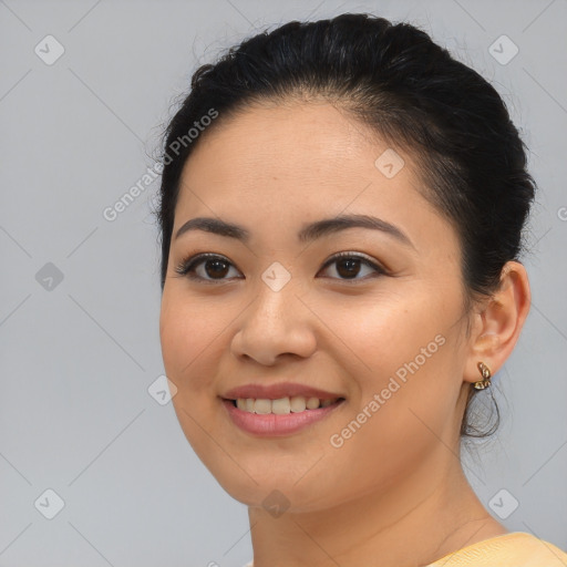 Joyful asian young-adult female with medium  brown hair and brown eyes