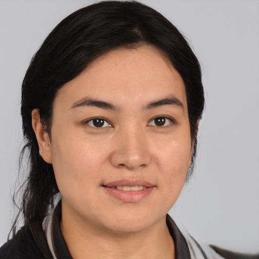 Joyful white young-adult female with medium  black hair and brown eyes