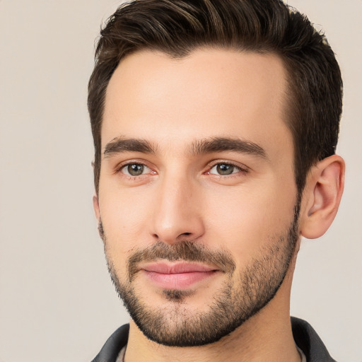 Joyful white young-adult male with short  brown hair and brown eyes