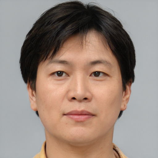 Neutral asian adult male with short  brown hair and brown eyes