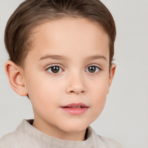 Joyful white child female with short  brown hair and brown eyes