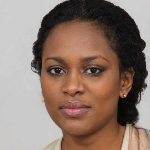 Neutral black young-adult female with long  brown hair and brown eyes