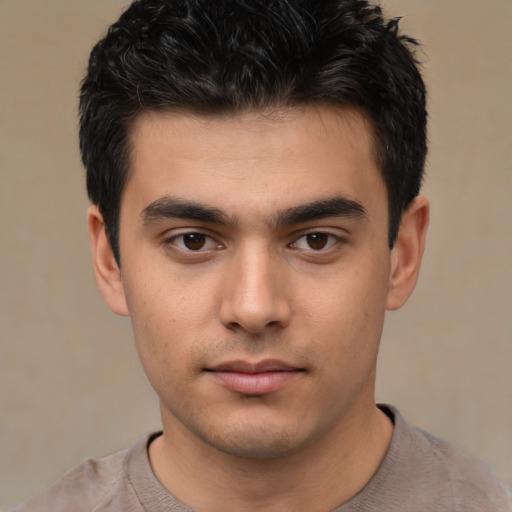Neutral white young-adult male with short  black hair and brown eyes