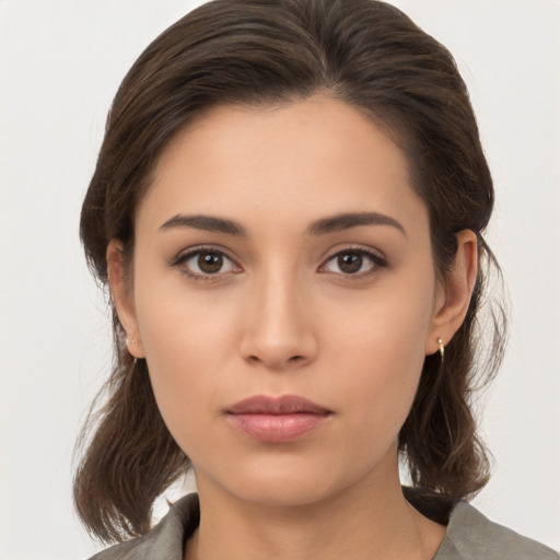 Neutral white young-adult female with medium  brown hair and brown eyes