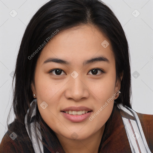 Joyful asian young-adult female with long  brown hair and brown eyes