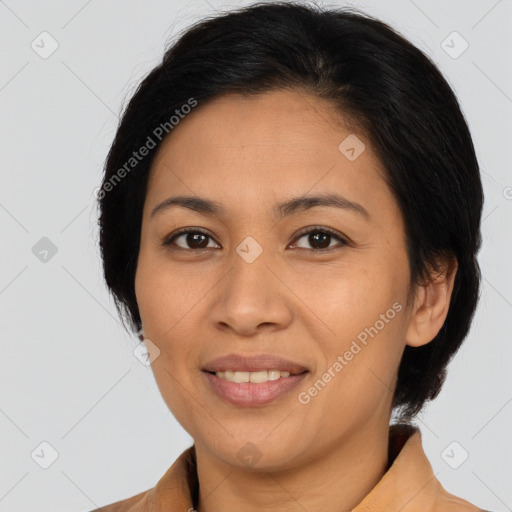 Joyful latino young-adult female with medium  brown hair and brown eyes