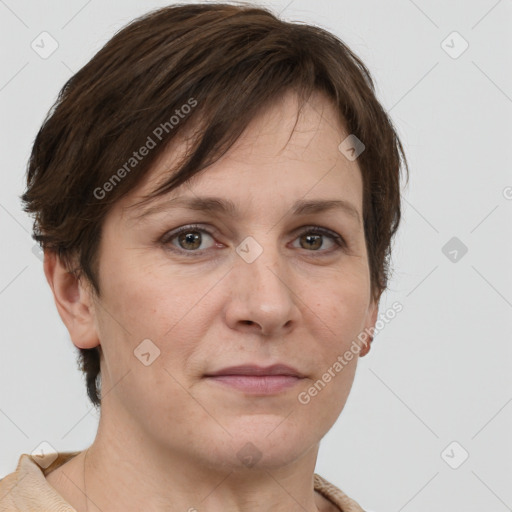 Joyful white adult female with short  brown hair and grey eyes