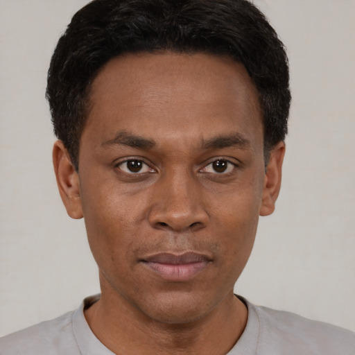 Neutral black young-adult male with short  black hair and brown eyes