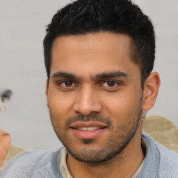 Joyful white young-adult male with short  black hair and brown eyes