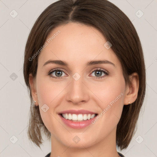 Joyful white young-adult female with medium  brown hair and green eyes