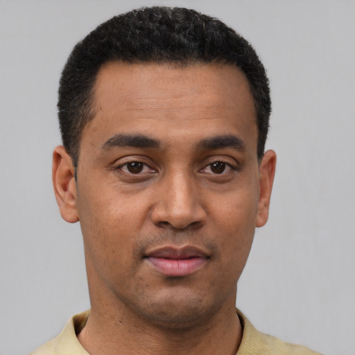 Neutral latino young-adult male with short  black hair and brown eyes