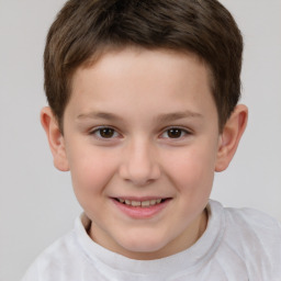 Joyful white child male with short  brown hair and brown eyes