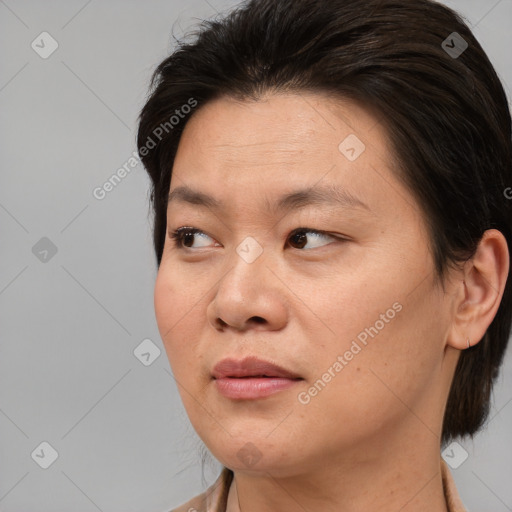 Joyful white young-adult female with medium  brown hair and brown eyes