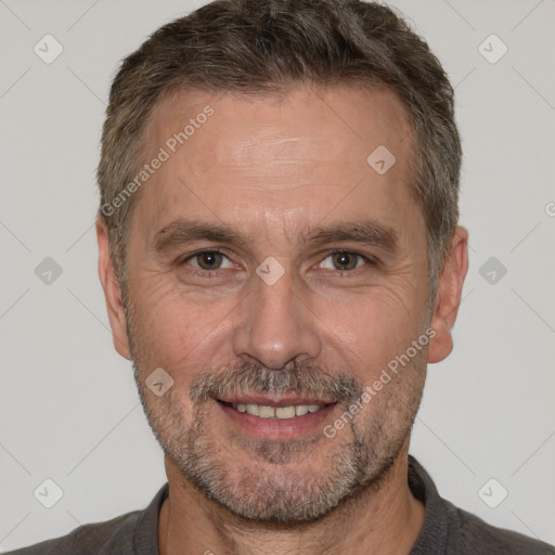 Joyful white adult male with short  brown hair and brown eyes