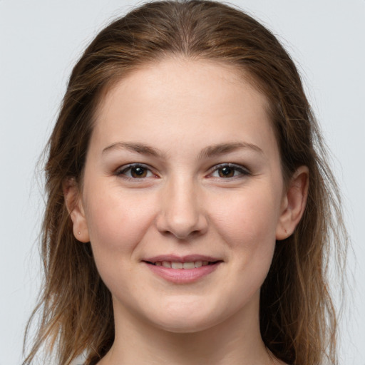 Joyful white young-adult female with long  brown hair and grey eyes