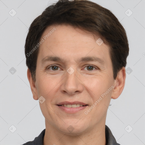 Joyful white adult male with short  brown hair and brown eyes