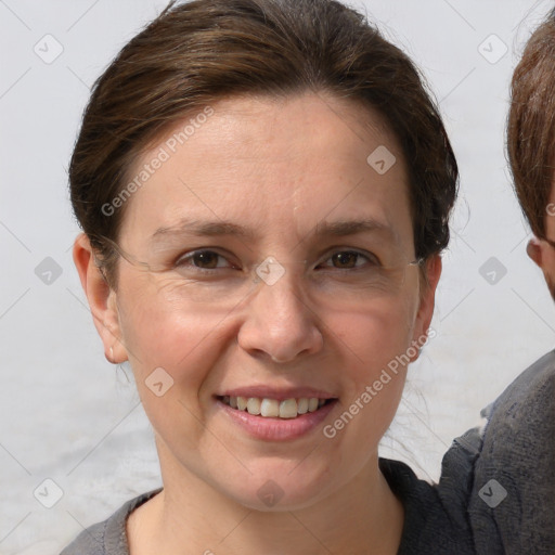 Joyful white adult female with short  brown hair and grey eyes