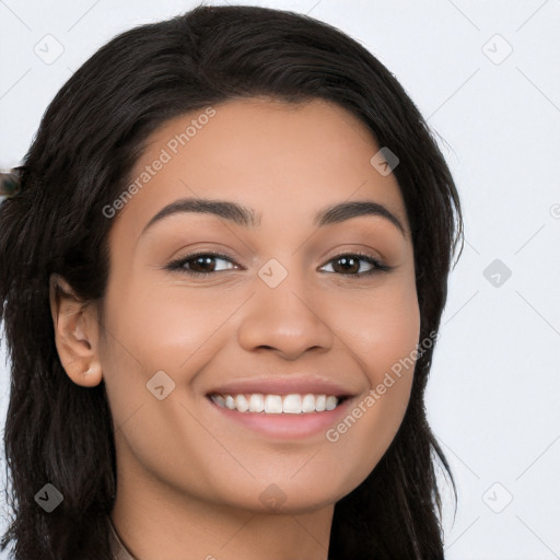 Joyful latino young-adult female with long  black hair and brown eyes