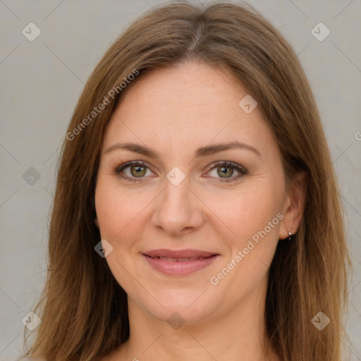 Joyful white young-adult female with long  brown hair and green eyes