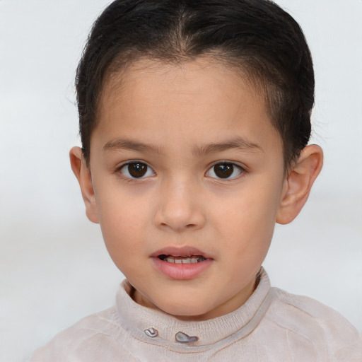 Joyful white child female with short  brown hair and brown eyes