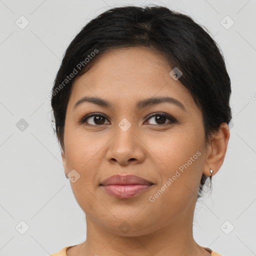 Joyful latino young-adult female with short  brown hair and brown eyes