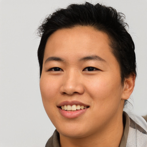 Joyful asian young-adult female with short  brown hair and brown eyes