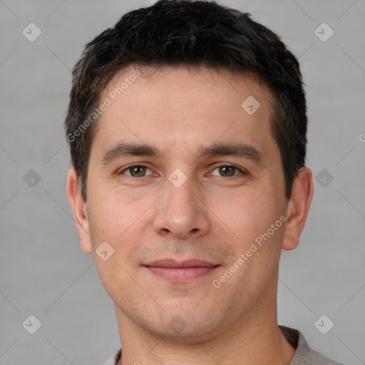 Joyful white young-adult male with short  brown hair and brown eyes