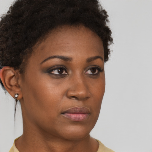 Neutral black young-adult female with short  brown hair and brown eyes