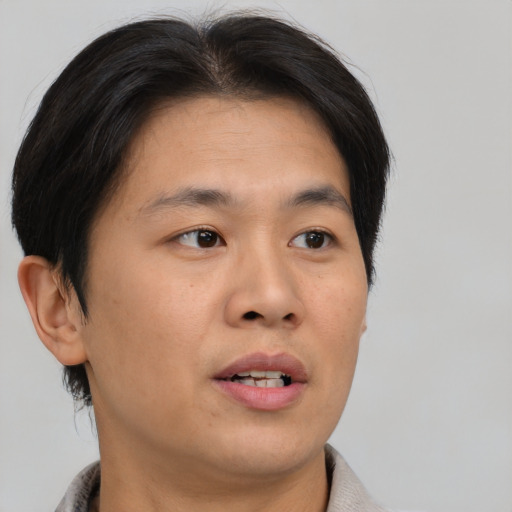 Neutral asian young-adult male with short  brown hair and brown eyes