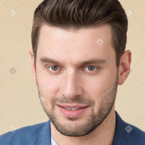 Joyful white young-adult male with short  brown hair and brown eyes