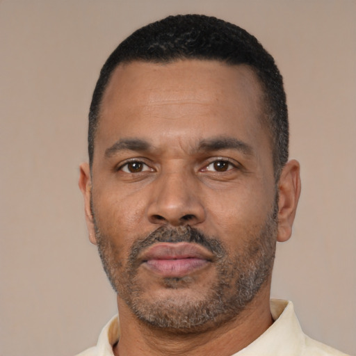 Neutral black adult male with short  black hair and brown eyes