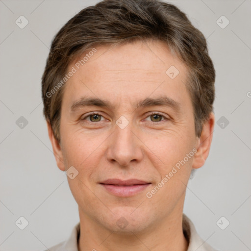 Joyful white adult male with short  brown hair and grey eyes