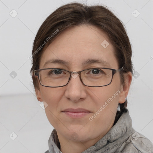 Joyful white adult female with short  brown hair and grey eyes