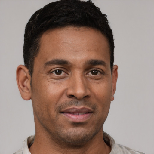Neutral black young-adult male with short  brown hair and brown eyes