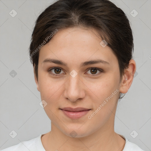 Joyful white young-adult female with short  brown hair and brown eyes