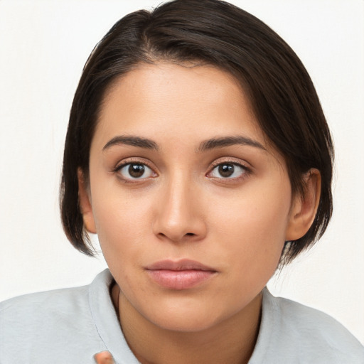 Neutral white young-adult female with medium  brown hair and brown eyes