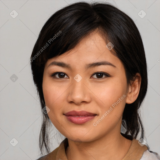 Joyful asian young-adult female with medium  black hair and brown eyes