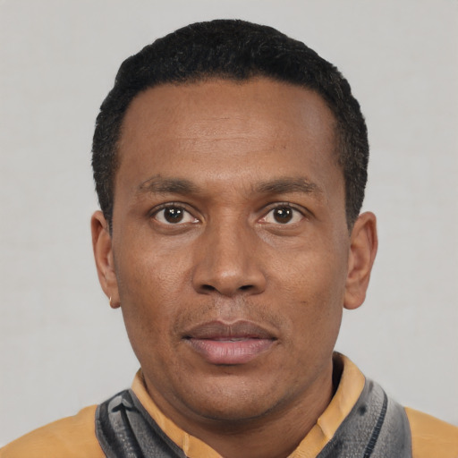 Neutral latino adult male with short  black hair and brown eyes