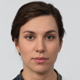 Neutral white young-adult female with short  brown hair and brown eyes