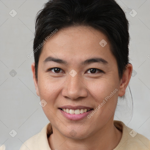 Joyful asian young-adult female with short  brown hair and brown eyes