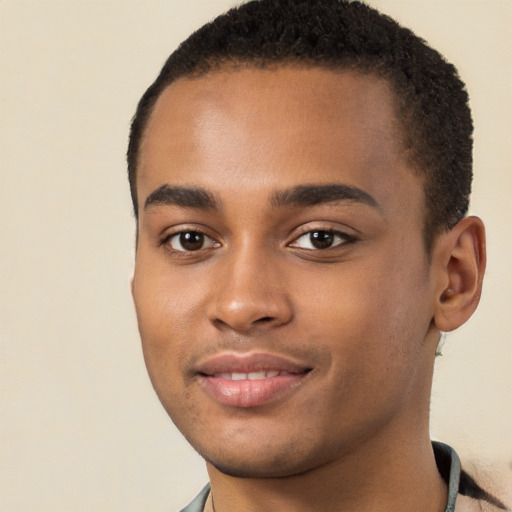 Joyful black young-adult male with short  brown hair and brown eyes