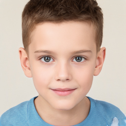 Joyful white child male with short  brown hair and brown eyes