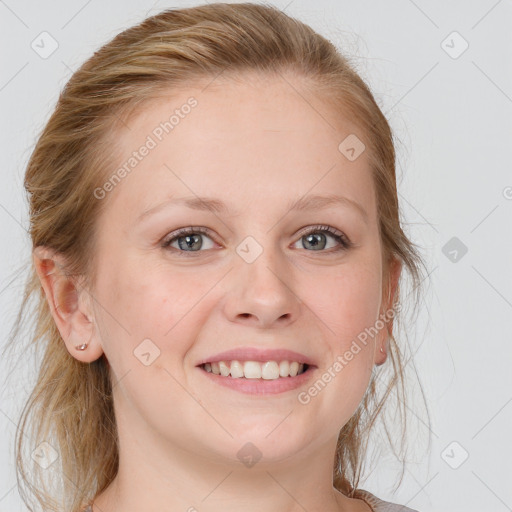 Joyful white young-adult female with medium  brown hair and blue eyes