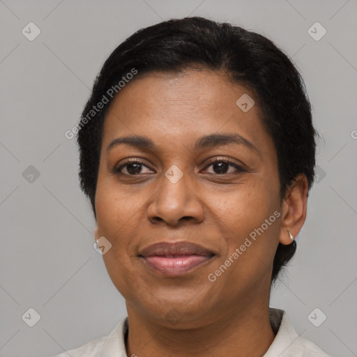 Joyful latino adult female with short  black hair and brown eyes