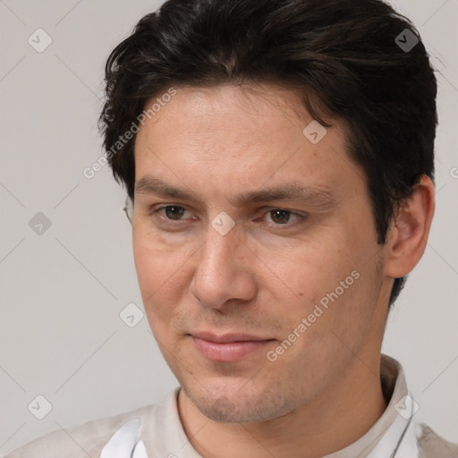 Joyful white adult male with short  brown hair and brown eyes