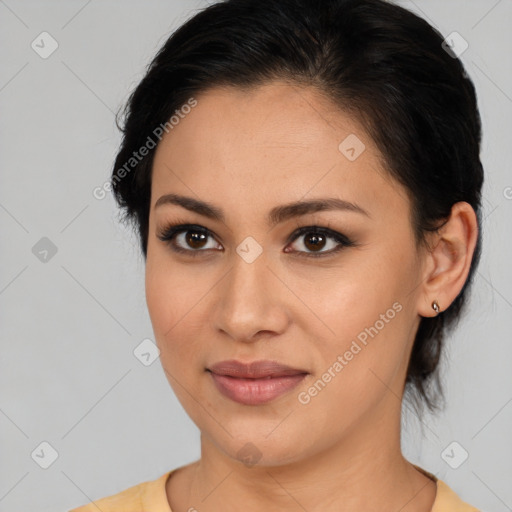 Joyful latino young-adult female with medium  brown hair and brown eyes